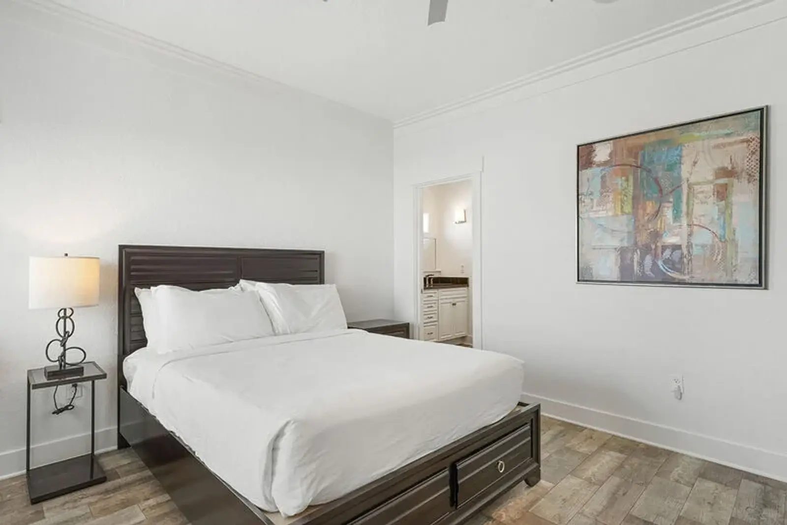Bedroom with a king bed and a door to a balcony
